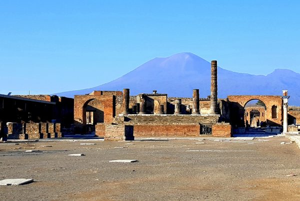 ruins of city of pompeii, naples with mount vesuvius in the background